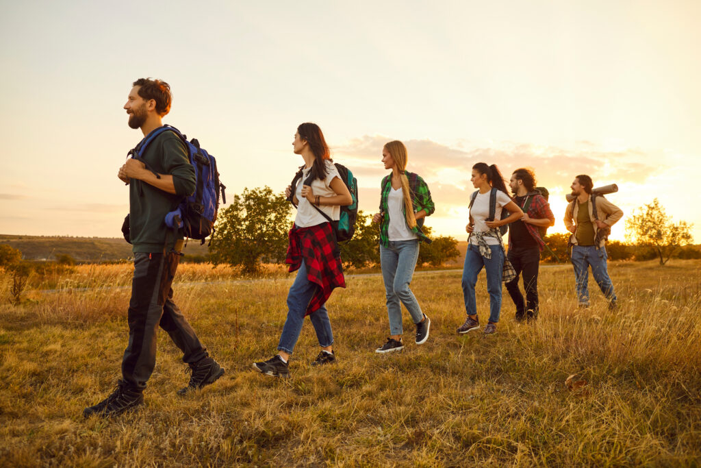 People Group Hiking In Nature On Vacation